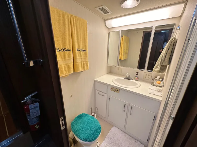 Slide: The Image of Bathroom interior of 1987 Hatteras 63 Motor Yacht with vanity and towels. - 37