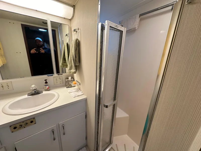 Slide: The Image of Bathroom interior of 1987 Hatteras 63 Motor Yacht with shower and sink. - 38