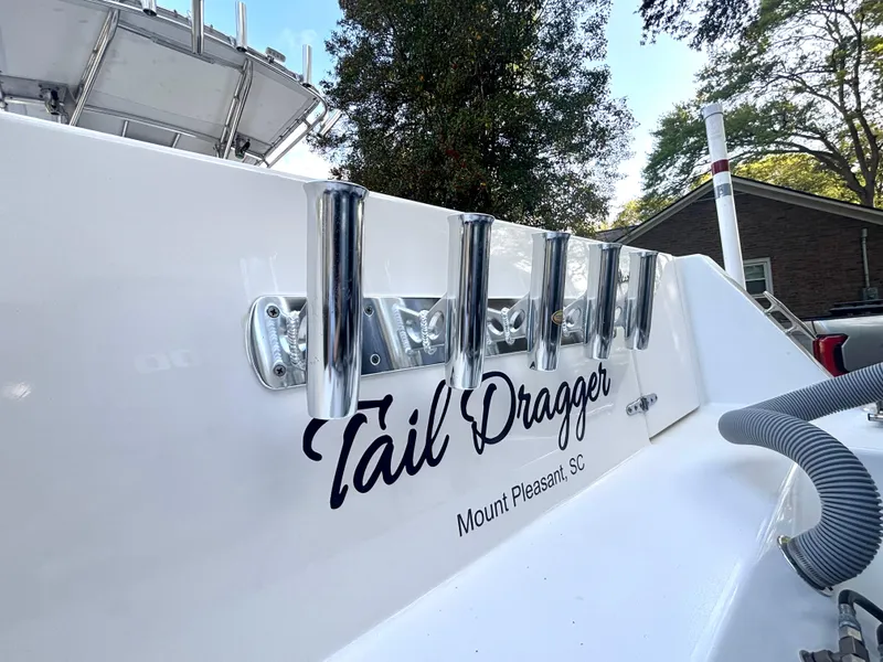 Slide: The Image of 2015 Contender 30 ST boat with rod holders, "Tail Dragger" text, Mount Pleasant, SC. - 16