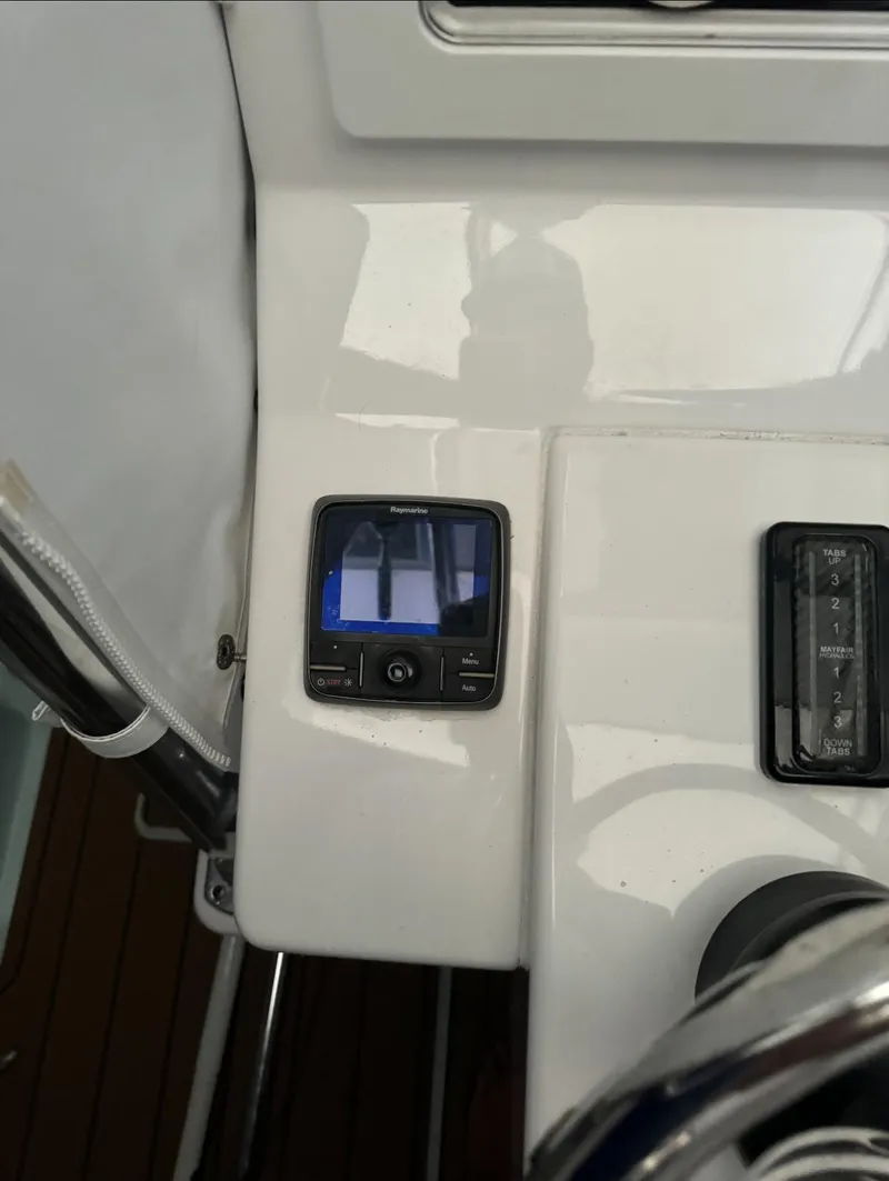 Slide: The Image of 2015 Contender 30 ST boat dashboard with electronic display and controls. - 26