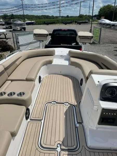 Slide: The Image of 2022 Hurricane SS 201 OB boat with beige seating and wood-style flooring. - 2