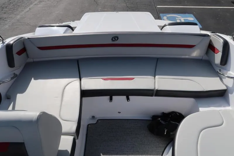 Slide: The Image of 2023 Hurricane SunDeck Sport 205 IO boat interior with white and red seating. - 11