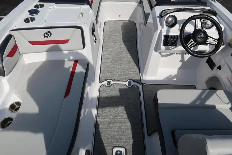 Slide: The Image of 2023 Hurricane SunDeck Sport 205 IO interior with steering wheel and seating. - 12