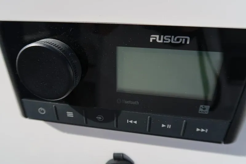 Slide: The Image of Close-up of Fusion audio system on 2023 Hurricane SunDeck Sport 205 IO boat. - 18
