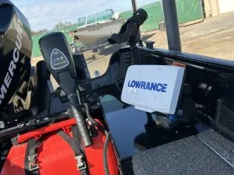 Slide: The Image of 2014 Lowe FM 160 T boat with Mercury motor and Lowrance navigation system. - 2