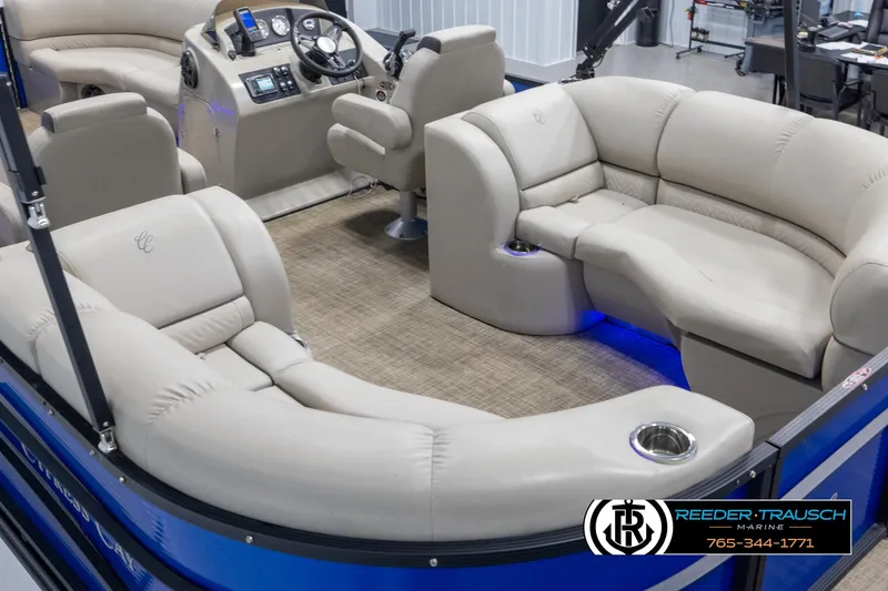 Slide: The Image of 2018 Cypress Cay 233 Seabreeze pontoon boat interior with beige seating and modern dashboard. - 10
