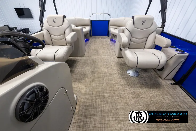 Slide: The Image of 2018 Cypress Cay 233 Seabreeze boat interior with beige seating and modern design. - 13