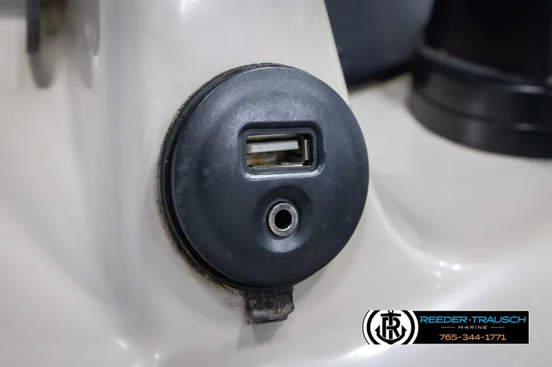 Slide: The Image of USB and audio port on 2018 Cypress Cay 233 Seabreeze boat dashboard. - 24