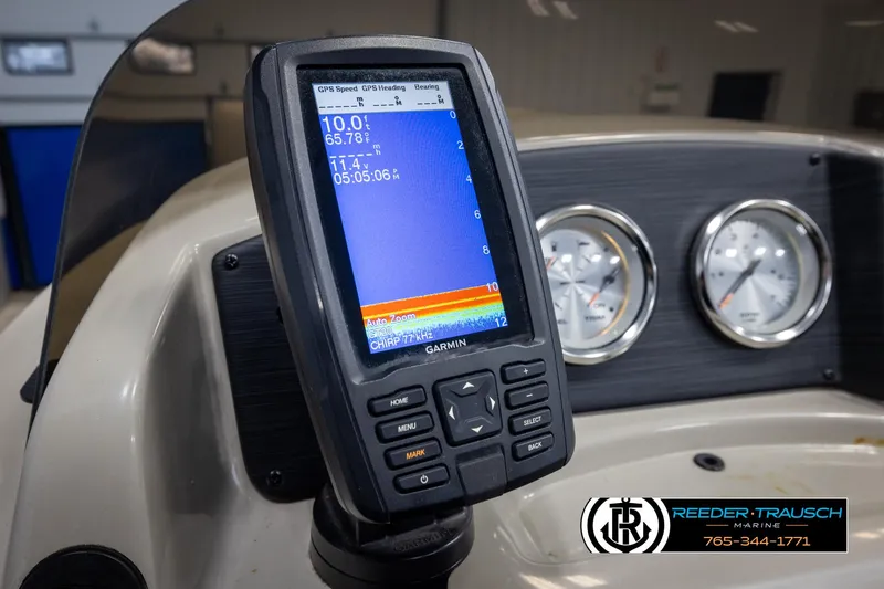 Slide: The Image of Garmin GPS device on 2018 Cypress Cay 233 Seabreeze boat dashboard with gauges. - 25