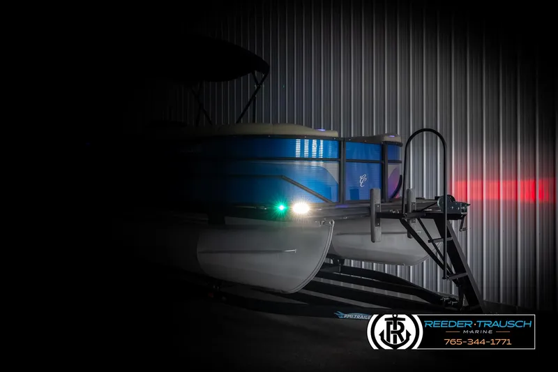 Slide: The Image of 2018 Cypress Cay 233 Seabreeze pontoon boat in dimly lit storage. - 3