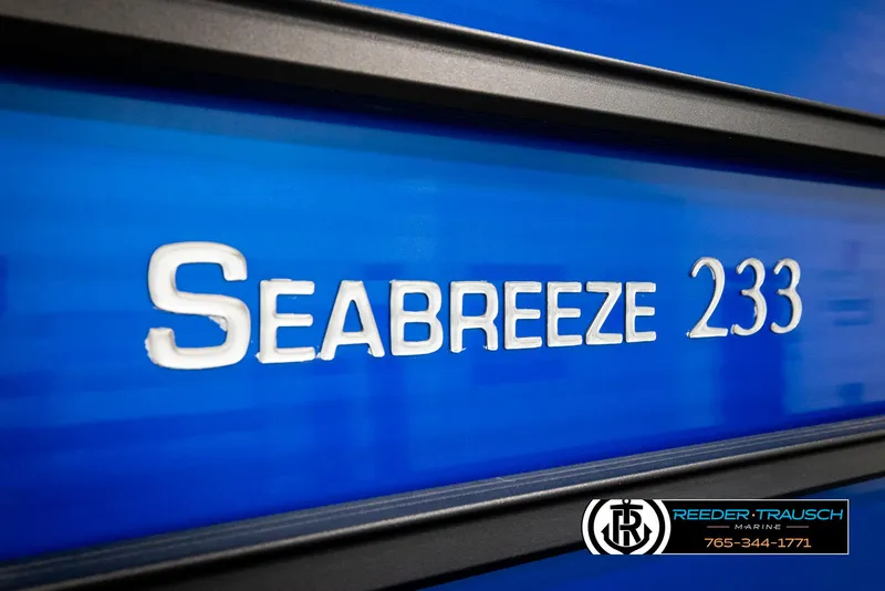 Slide: The Image of 2018 Cypress Cay 233 Seabreeze boat nameplate on blue background. - 39