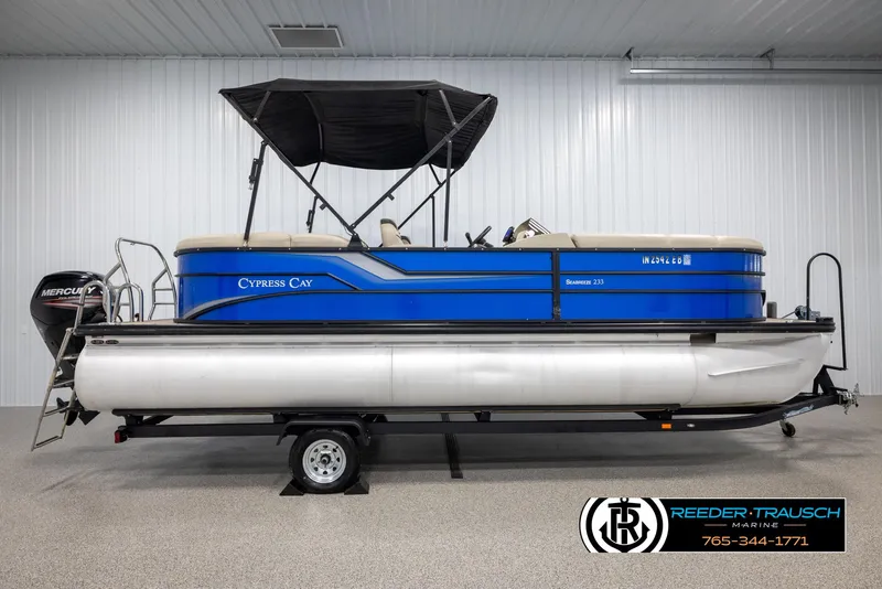 Slide: The Image of 2018 Cypress Cay 233 Seabreeze pontoon boat on trailer in indoor showroom. - 4