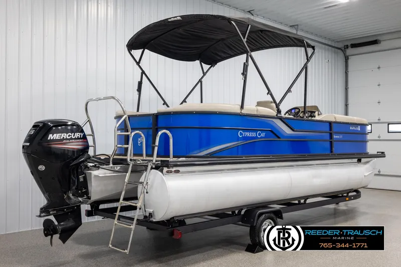 Slide: The Image of 2018 Cypress Cay 233 Seabreeze pontoon boat with Mercury engine in indoor storage. - 5