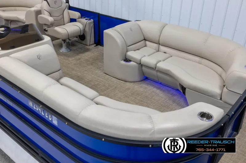 Slide: The Image of 2018 Cypress Cay 233 Seabreeze pontoon boat with beige seating and blue accents. - 8