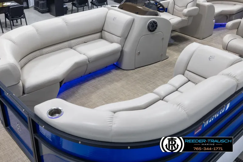 Slide: The Image of 2018 Cypress Cay 233 Seabreeze pontoon boat with plush seating and blue accent lighting. - 9