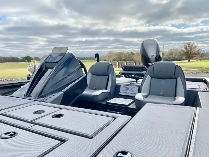 Slide: The Image of 2025 Express H20C boat with sleek design and comfortable seating on a cloudy day. - 3