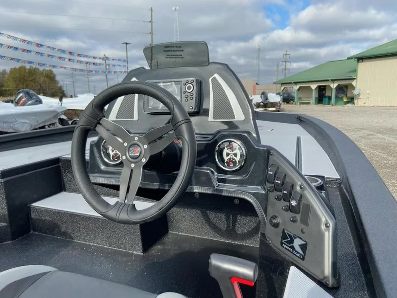 Slide: The Image of Steering console of 2025 Express H20C boat with modern controls and dashboard. - 4