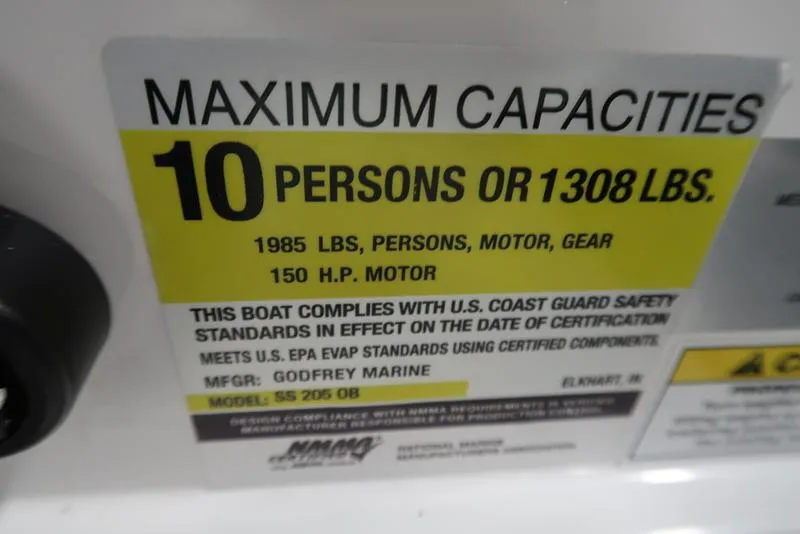 Slide: The Image of Maximum capacity label for 2023 Hurricane SunDeck Sport 205 OB: 10 persons or 1308 lbs. - 13