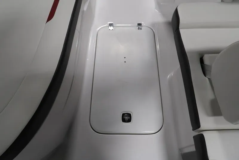Slide: The Image of 2023 Hurricane SunDeck Sport 205 OB boat storage compartment, white interior, sleek design. - 16