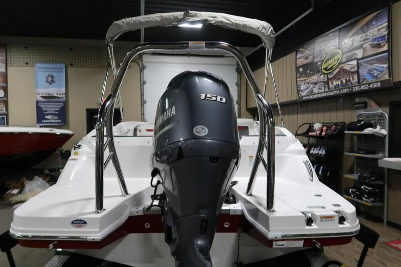 Slide: The Image of 2023 Hurricane SunDeck Sport 205 OB with Yamaha 150 outboard motor in showroom. - 4
