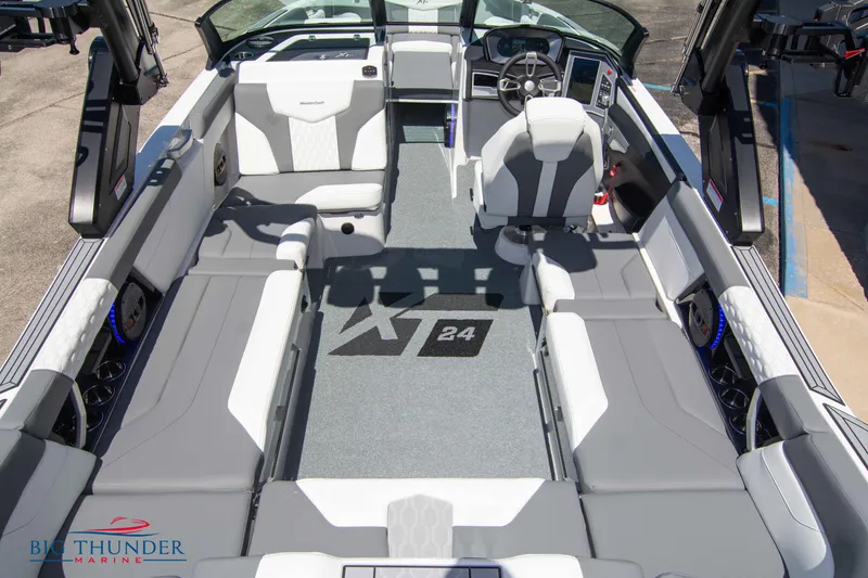 Slide: The Image of 2024 MasterCraft XT24 boat interior with spacious seating and modern design. - 15