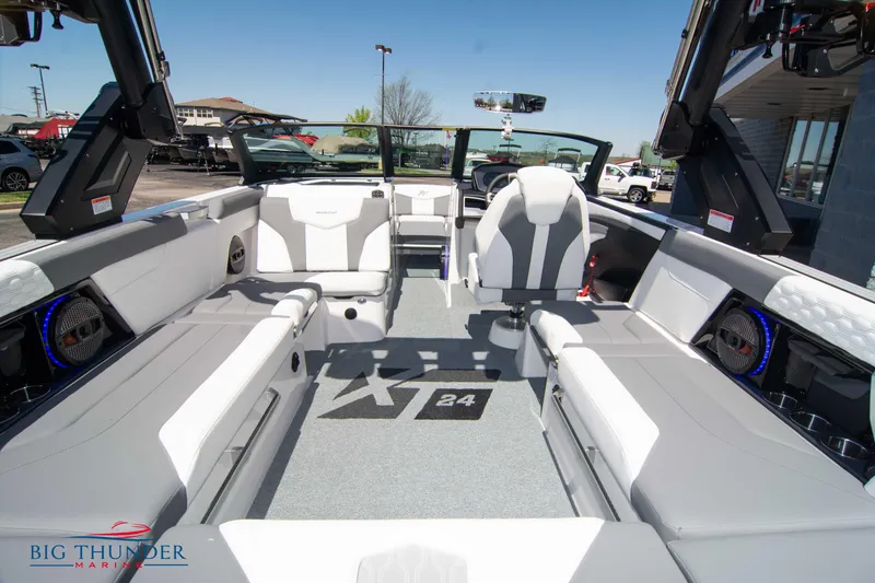 Slide: The Image of 2024 MasterCraft XT24 boat interior with modern seating and sleek design. - 17