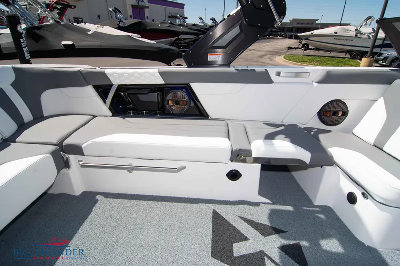 Slide: The Image of 2024 MasterCraft XT24 boat interior with sleek seating and modern design. - 20