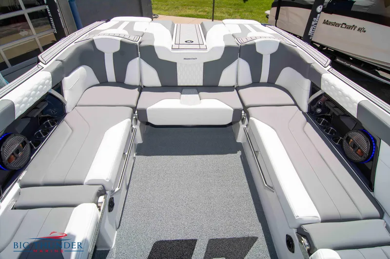 Slide: The Image of 2024 MasterCraft XT24 boat interior with gray and white seating, showcasing modern design and spacious layout. - 22