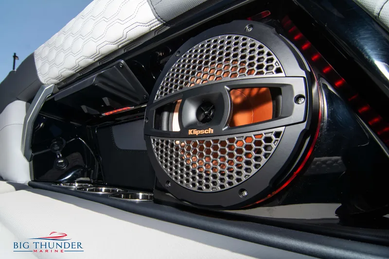 Slide: The Image of 2024 MasterCraft XT24 boat with Klipsch speaker system, featuring sleek design and premium audio. - 28