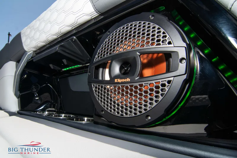 Slide: The Image of 2024 MasterCraft XT24 boat with Klipsch speaker and stylish interior design. - 30