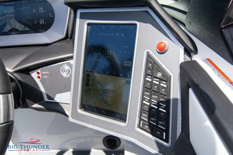 Slide: The Image of 2024 MasterCraft XT24 dashboard with touchscreen and control panel. - 38