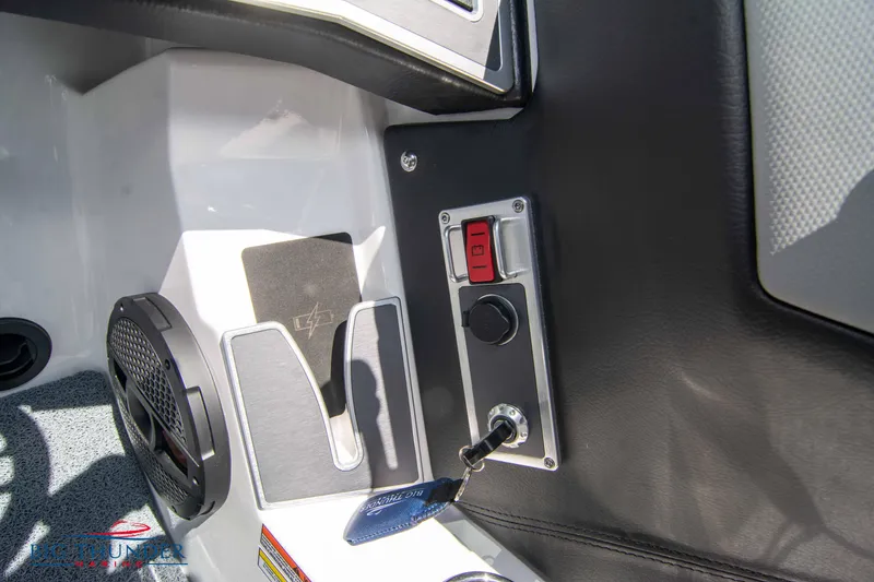 Slide: The Image of 2024 MasterCraft XT24 boat interior with control panel and speaker. - 39