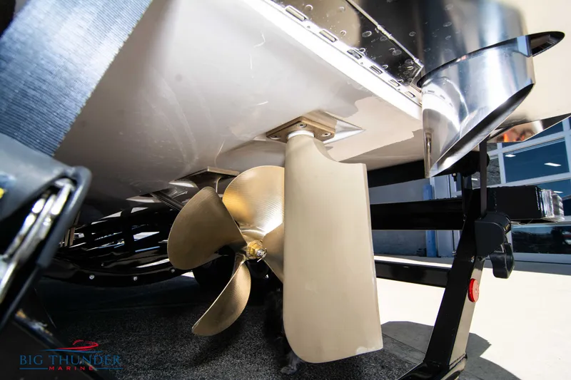 Slide: The Image of 2024 MasterCraft XT24 boat propeller and rudder detail. - 8