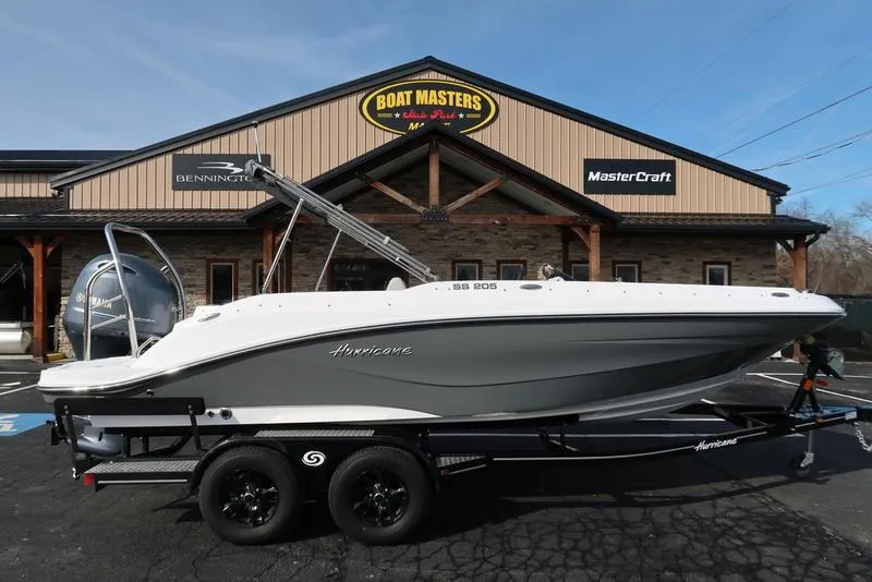 Slide: The Image of 2023 Hurricane SunDeck Sport 205 OB boat on trailer outside Boat Masters store. - 1