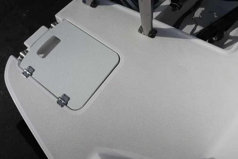 Slide: The Image of 2023 Hurricane SunDeck Sport 205 OB boat deck with storage hatch. - 15