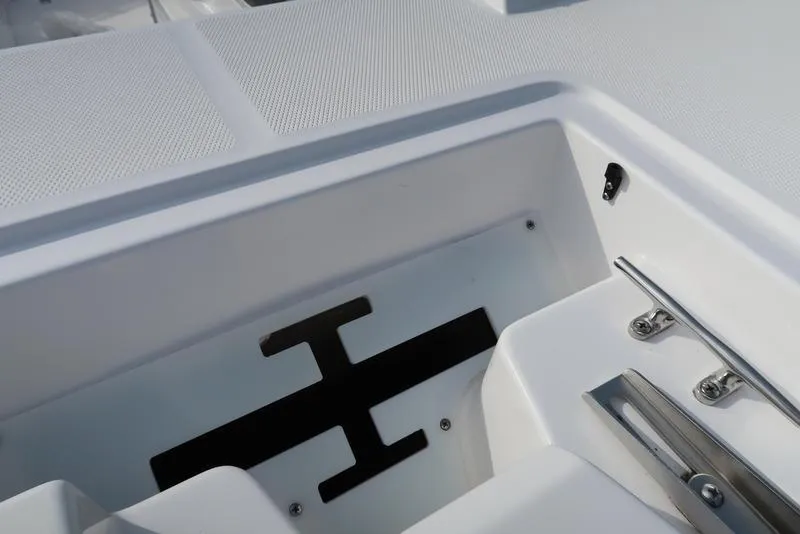 Slide: The Image of 2023 Hurricane SunDeck Sport 205 OB boat interior detail with sleek white finish and hardware. - 21