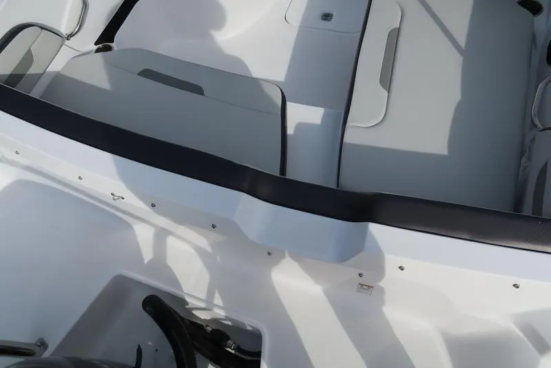 Slide: The Image of 2023 Hurricane SunDeck Sport 205 OB interior with seating and storage compartments. - 23