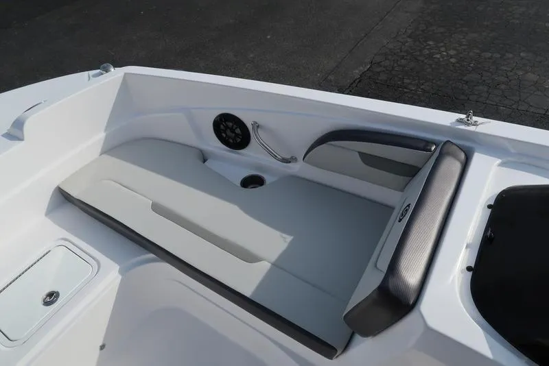 Slide: The Image of 2023 Hurricane SunDeck Sport 205 OB boat interior with cushioned seating and speaker. - 24