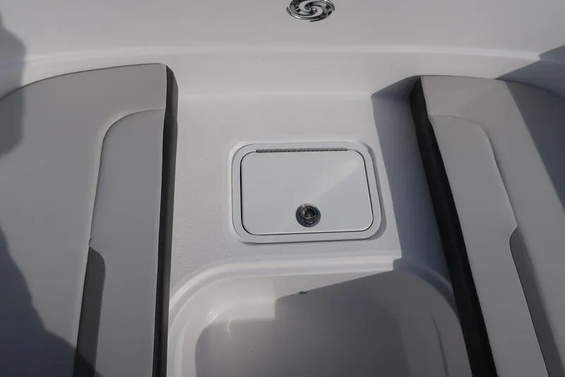 Slide: The Image of 2023 Hurricane SunDeck Sport 205 OB boat interior with storage compartment. - 26