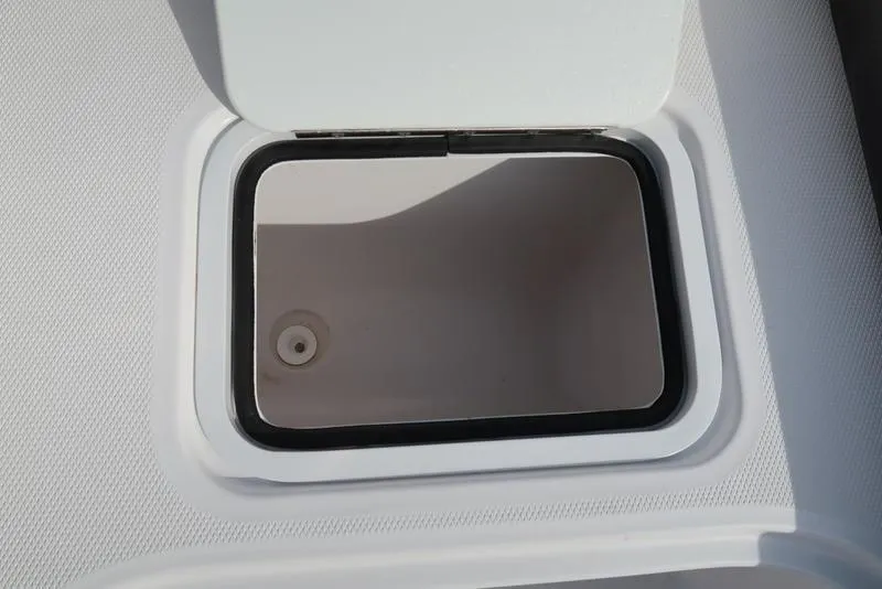 Slide: The Image of 2023 Hurricane SunDeck Sport 205 OB storage compartment with open hatch. - 27