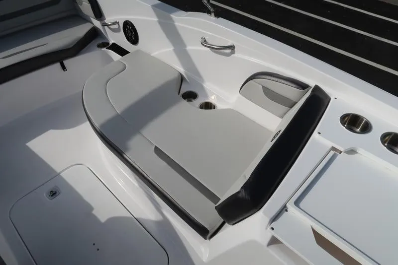 Slide: The Image of 2023 Hurricane SunDeck Sport 205 OB boat interior with seating and cup holders. - 29
