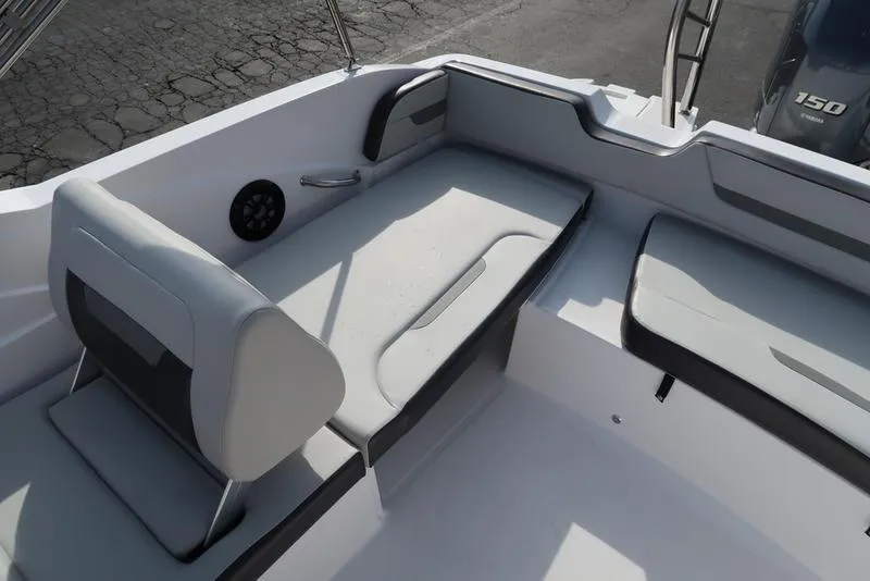Slide: The Image of 2023 Hurricane SunDeck Sport 205 OB boat interior with cushioned seating and modern design. - 31