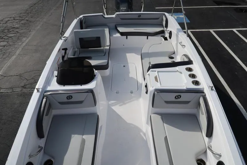 Slide: The Image of 2023 Hurricane SunDeck Sport 205 OB boat interior with seating and storage compartments. - 35