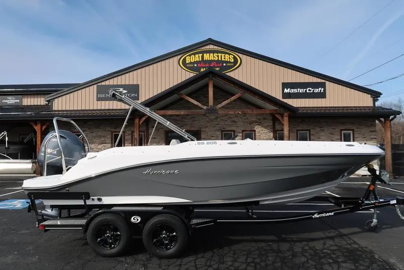 Slide: The Image of 2023 Hurricane SunDeck Sport 205 OB boat on trailer at dealership. - 5