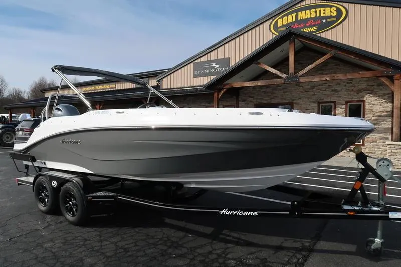 Slide: The Image of 2023 Hurricane SunDeck Sport 205 OB boat on trailer at dealership. - 6