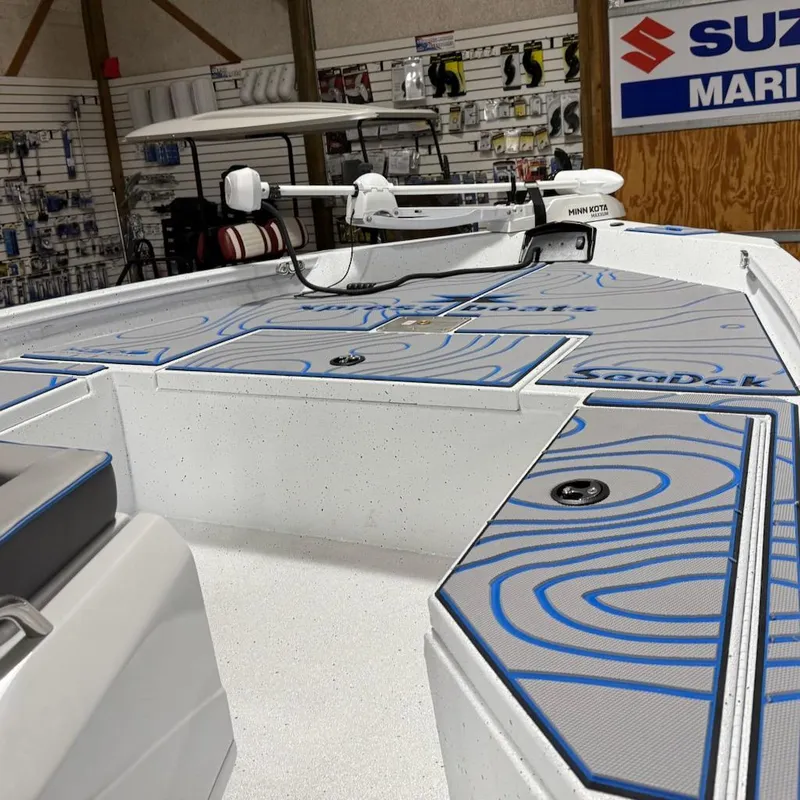 Slide: The Image of 2025 Express H20 Bay boat interior with SeaDek flooring and Minn Kota trolling motor. - 8