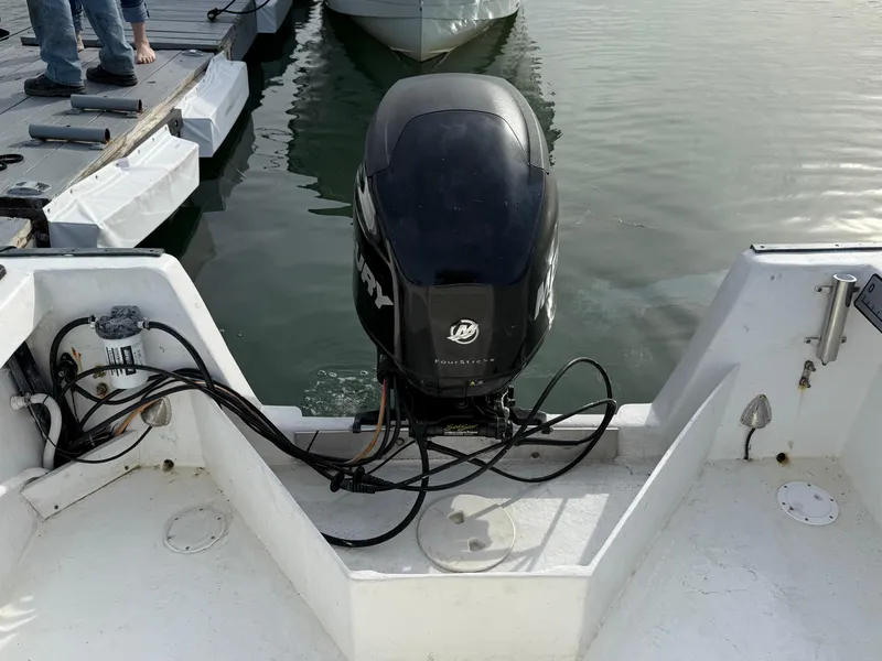 Slide: The Image of 2003 Key Largo 216cc boat with Mercury outboard motor at dock. - 15