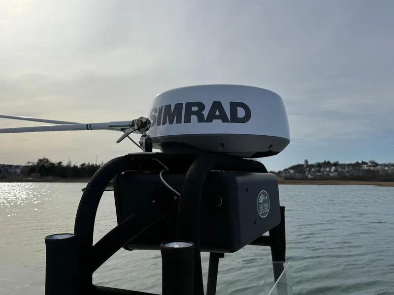 Slide: The Image of Simrad radar on 2003 Key Largo 216cc boat, calm waters in the background. - 17