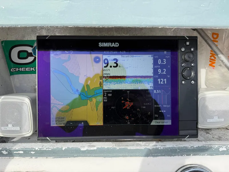 Slide: The Image of Simrad marine GPS display on 2003 Key Largo 216cc boat dashboard. - 18