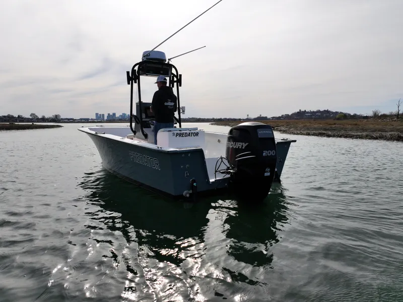 Slide: The Image of 2003 Key Largo 216cc boat on water with Mercury 200 engine. - 2